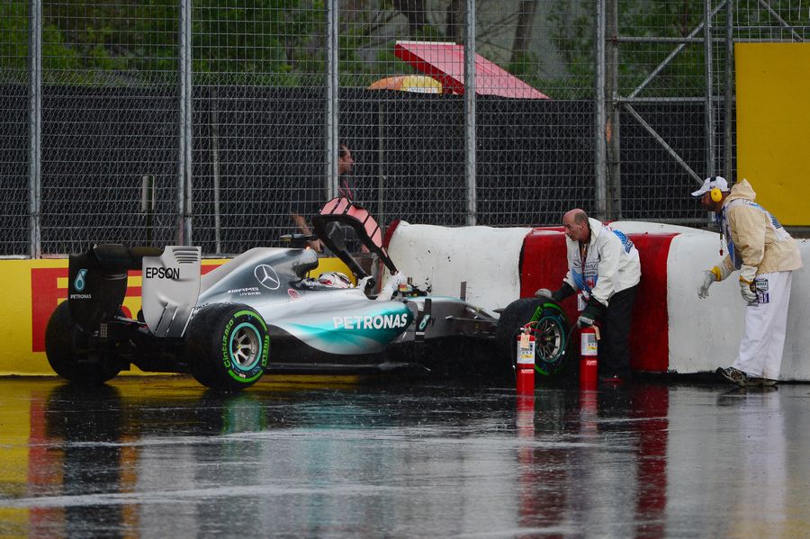 Lewis Hamilton hits the tyre wall in heavy rain during FP2