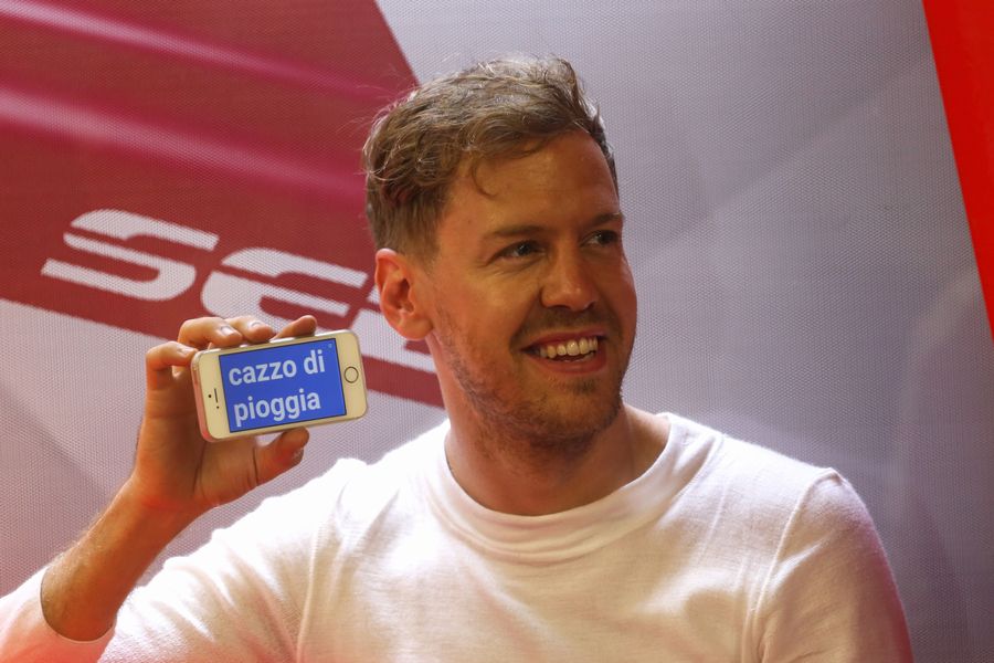 Sebastian Vettel shows his message on phone