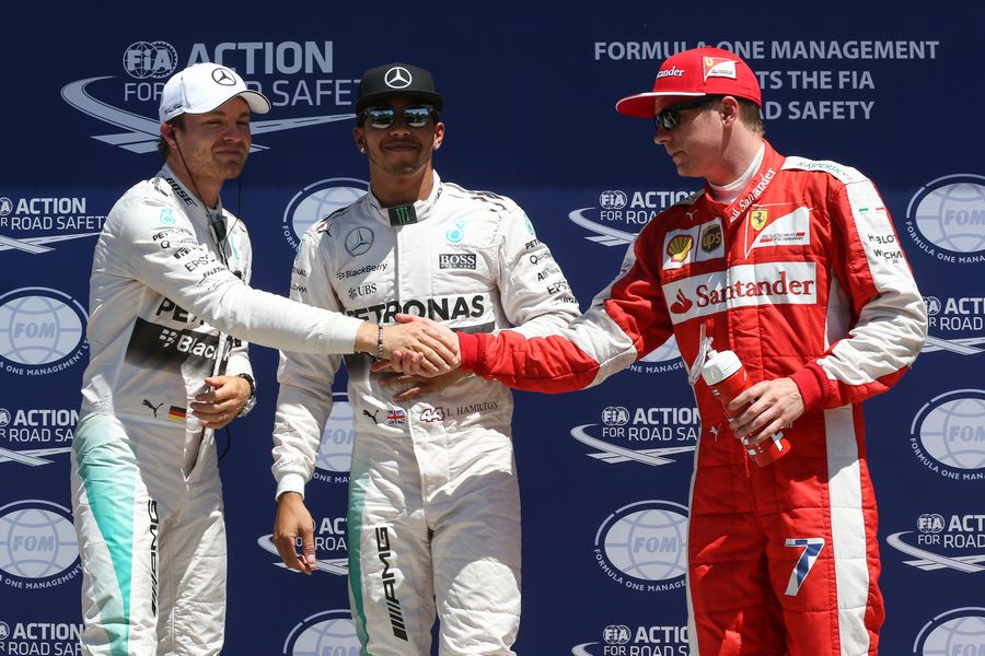Kimi Raikkonen congratulates Nico Rosberg after qualifying