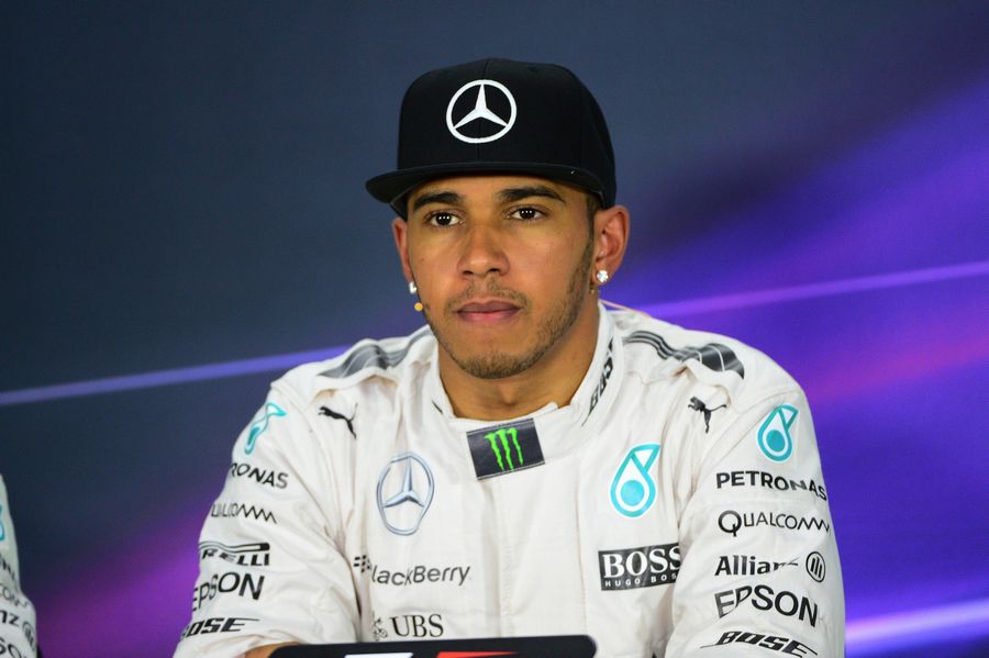 Lewis Hamilton looks on at the press conference after qualifying