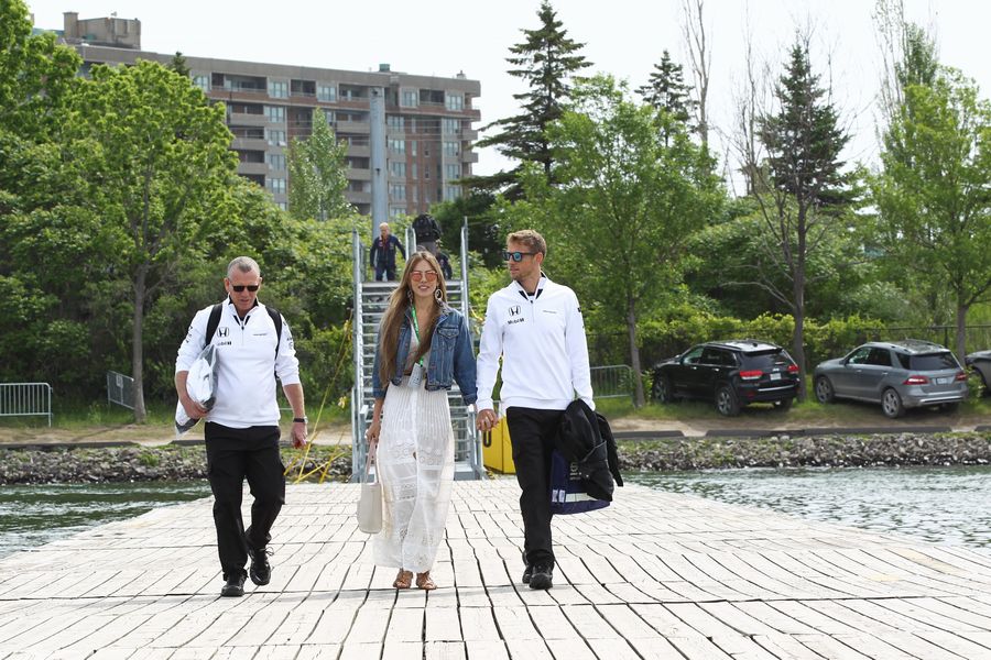 Jenson Button arrives the paddock with his wife Jessica Michibata