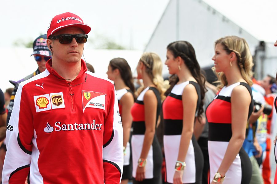 Kimi Raikkonen heads off to the drivers parade
