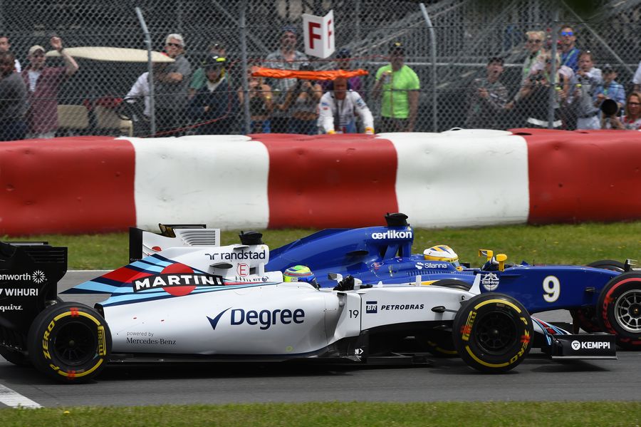 Felipe Massa and Marcus Ericsson battle for a position