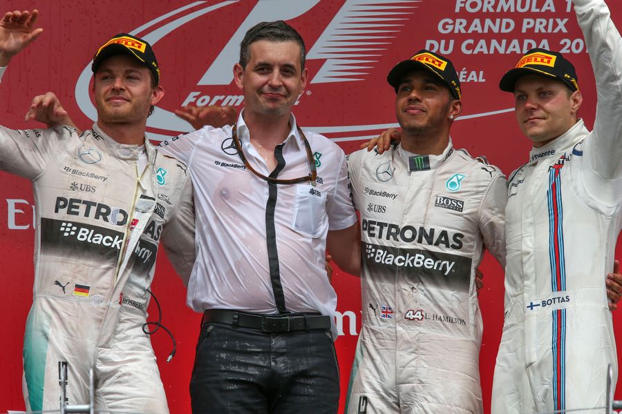 Lewis Hamilton, Nico Rosberg and Valtteri Bottas acknowledge the crowd during a podium ceremony