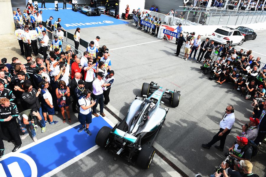 Race winner Lewis Hamilton parks his car in parc ferme