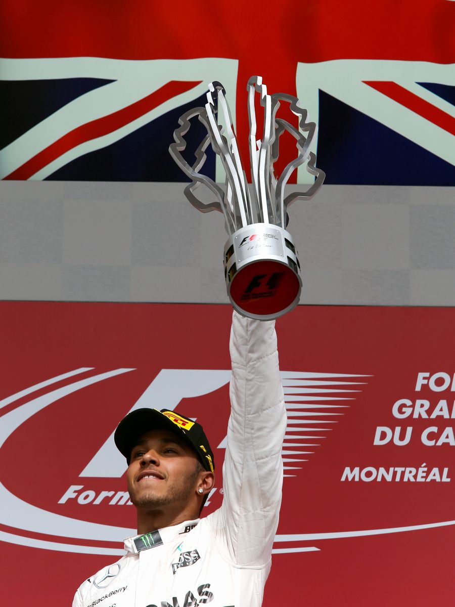 Lewis Hamilton celebrates his Montreal victory on the podium