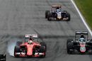 Sebastian Vettel locks up while passing Fernando Alonso