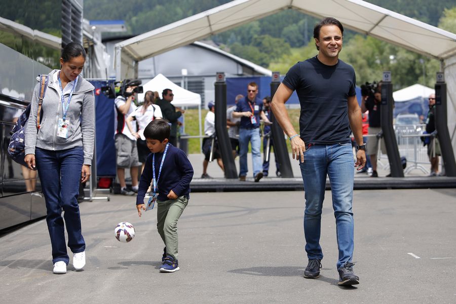 Felipe Massa arrives the paddock with his son