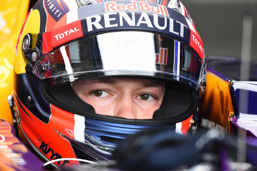 Daniil Kvyat sits in the Red Bull cockpit
