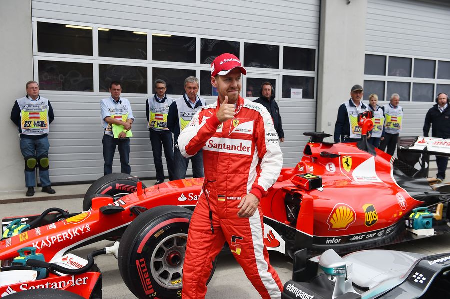 Sebastian Vettel poses in parc ferme after qualifying third