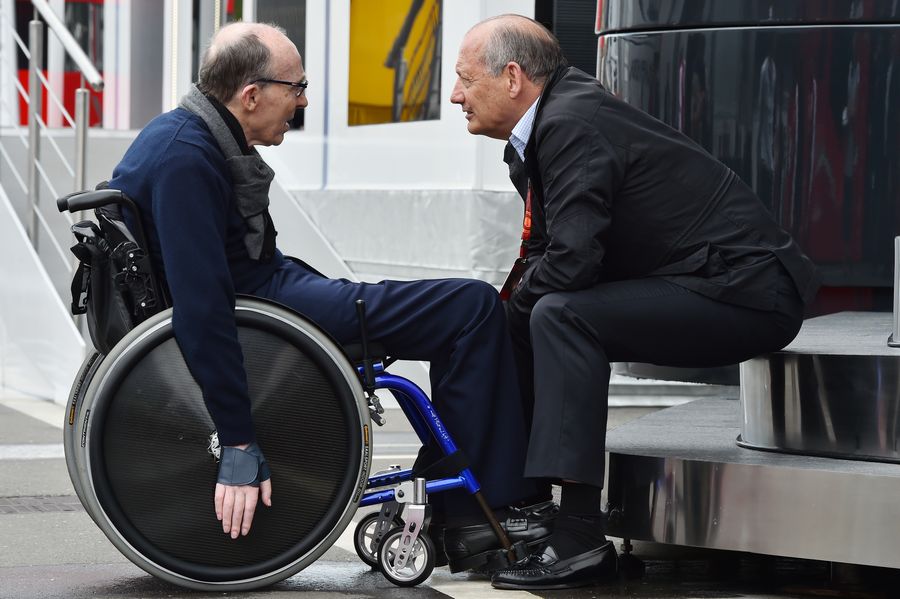 Ron Dennis talks with Sir Frank Williams in the paddock