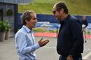 Alain Prost and Gerhard Berger chat in the paddock