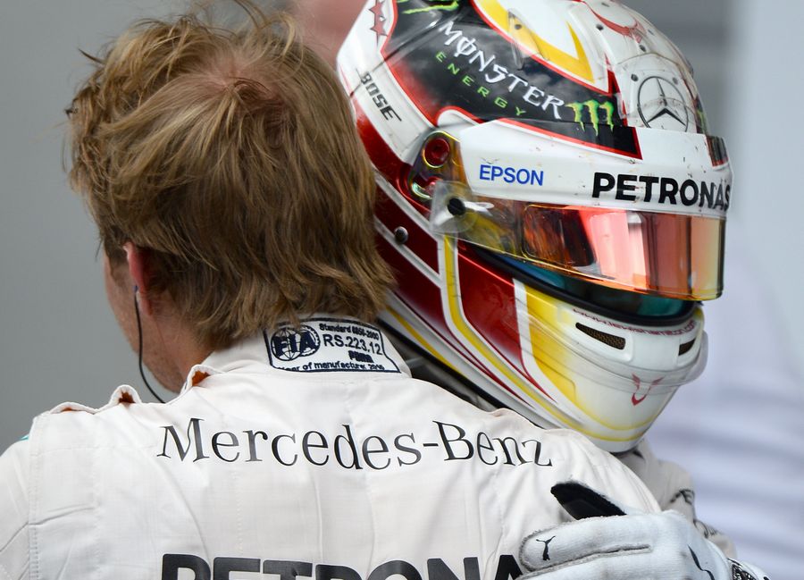 Lewis Hamilton celebrates Nico Rosberg for Mercedes 1-2