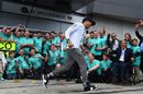 Lewis Hamilton celebrates with the team