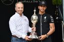 Lewis Hamilton receives the Hawthorn Memorial Trophy from Rob Jones