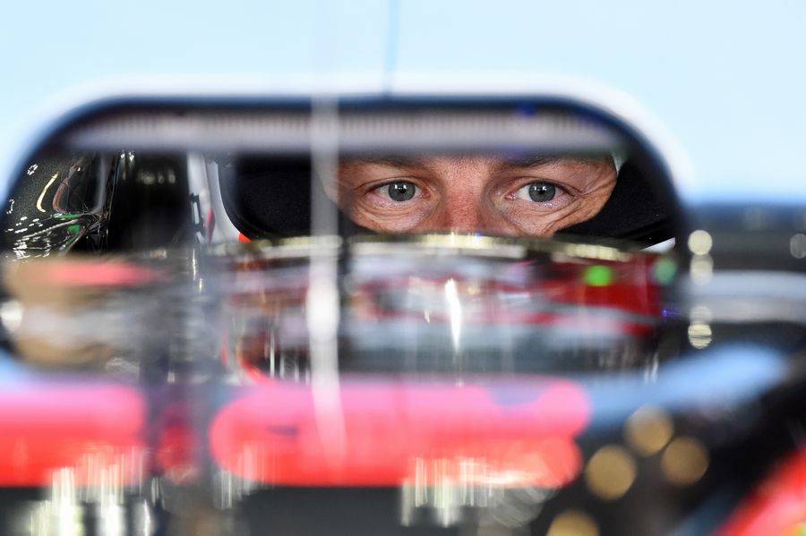 Jenson Button sits in the McLaren-Honda cockpit