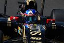 Jolyon Palmer cranks on the steering lock in the Lotus