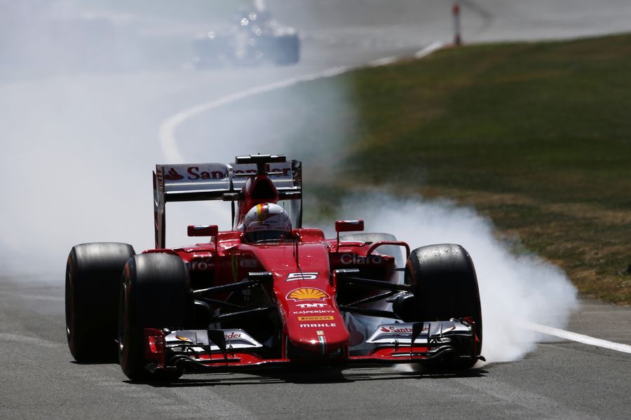 Sebastian Vettel locks up heavily in the Ferrari