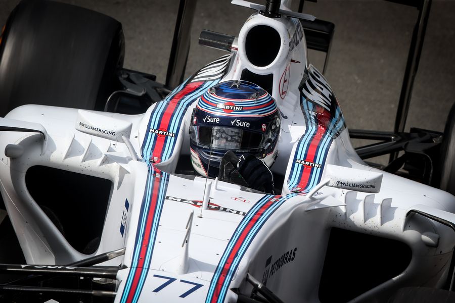 Valtteri Bottas cranks on the steering lock in the Williams