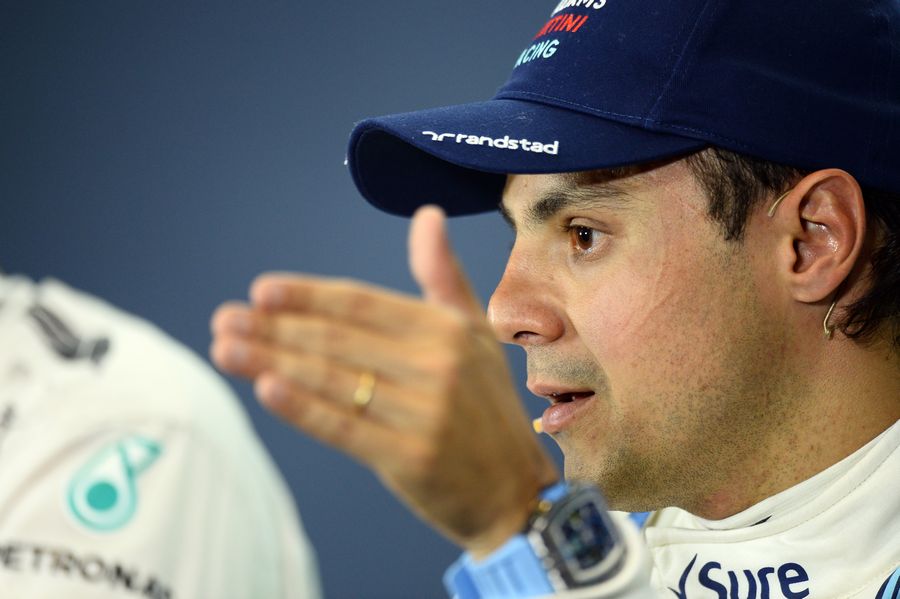 Felipe Massa talks to the media at the press conference after qualifying
