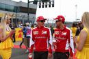 Kimi Raikkonen chats with Sebastian Vettel while heading off to the drivers parade