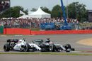 Lewis Hamilton battles for a position with Valtteri Bottas 