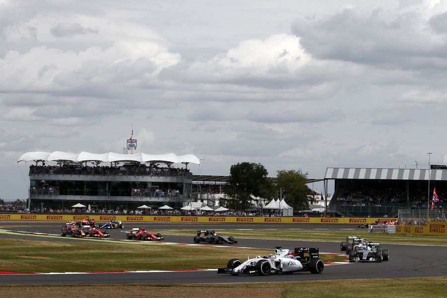 Felipe Massa leads the field after passing Lewis Hamilton at the start
