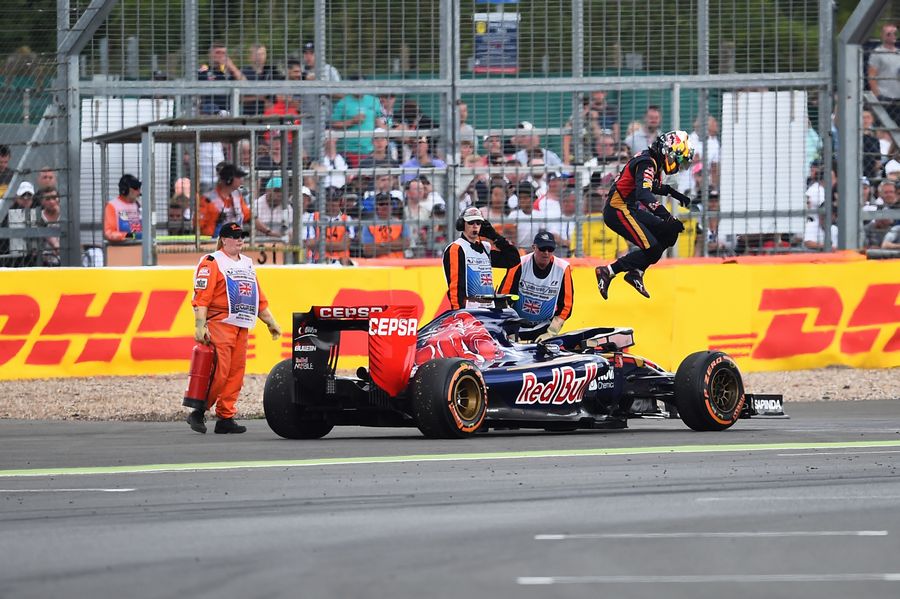 Carlos Sainz jumps out from his Toro Rosso