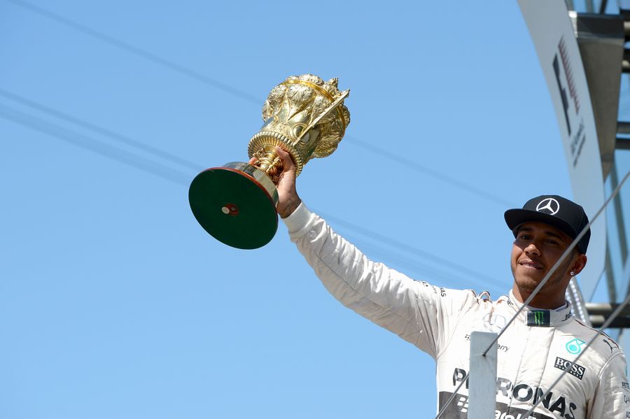 Lewis Hamilton celebrates his home race win