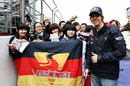 Sebastian Vettel poses for a photo with fans