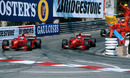 Eddie Irvine and Michael Schumacher celebrate a Ferrari one-two