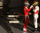 Fernando Alonso and Lewis Hamilton chat after the race