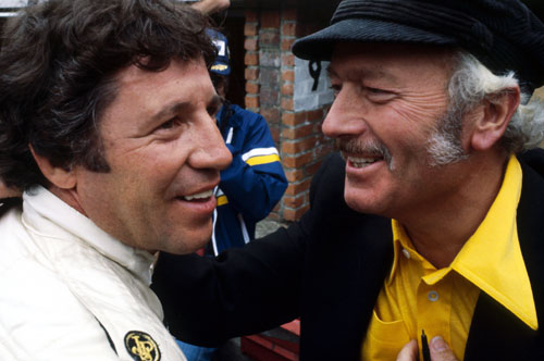 Mario Andretti and Colin Chapman celebrate winning the race