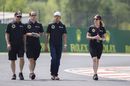 Pastor Maldonado walks the track with Lotus members