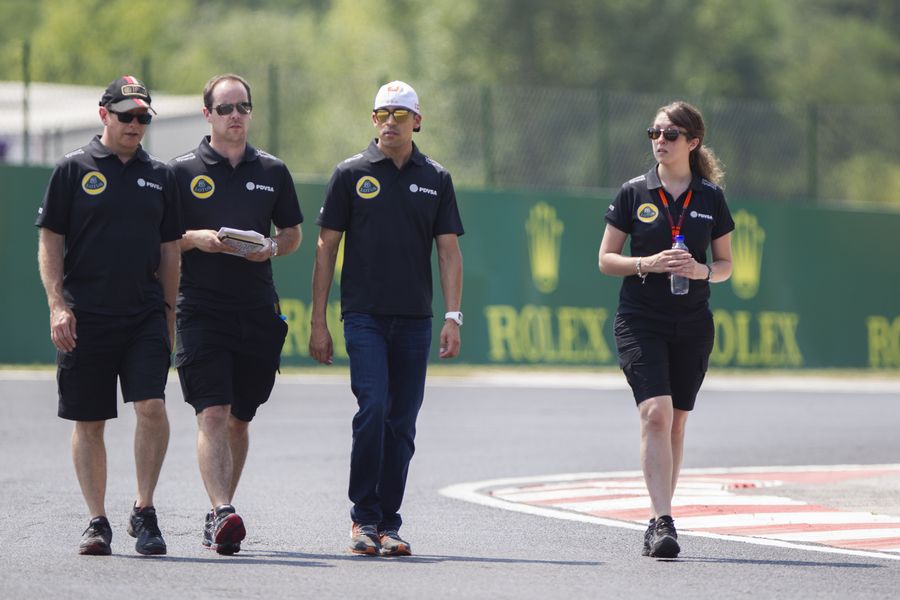 Pastor Maldonado walks the track with Lotus members