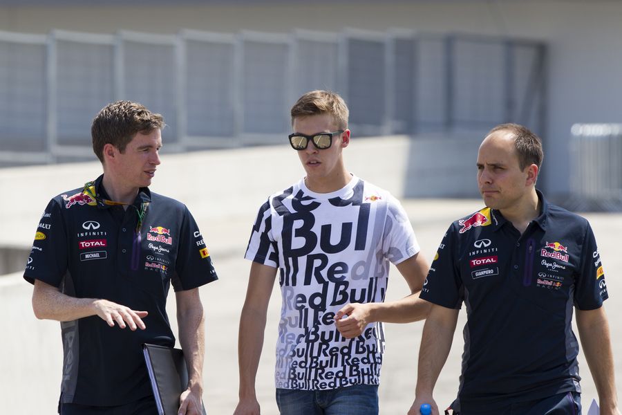 Daniil Kvyat walks the track with his race engineer Gianpiero Lambiase