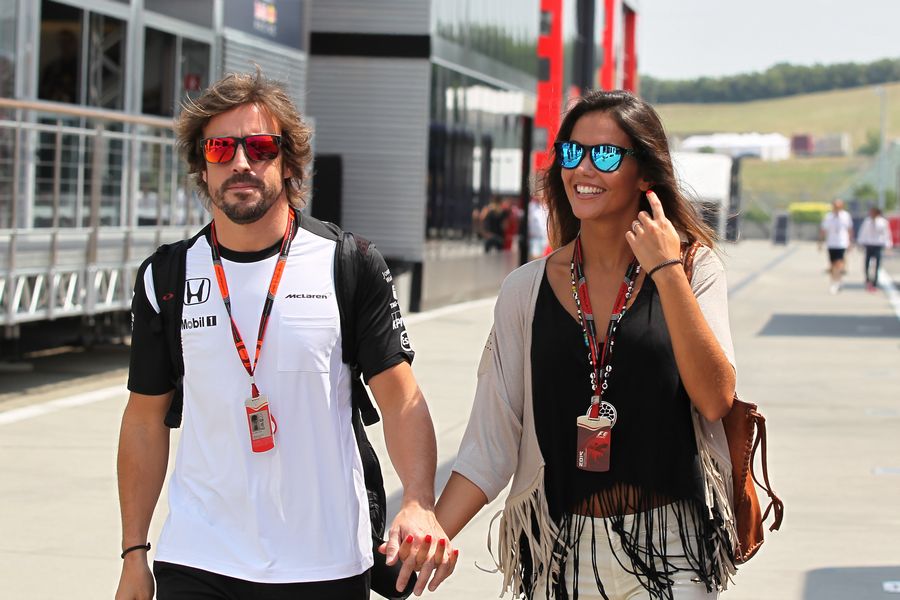 Fernando Alonso arrives at the paddock with his girlfriend Lara Alvarez