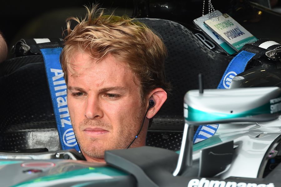 Nico Rosberg sits in the Mercedes cockpit in the garage
