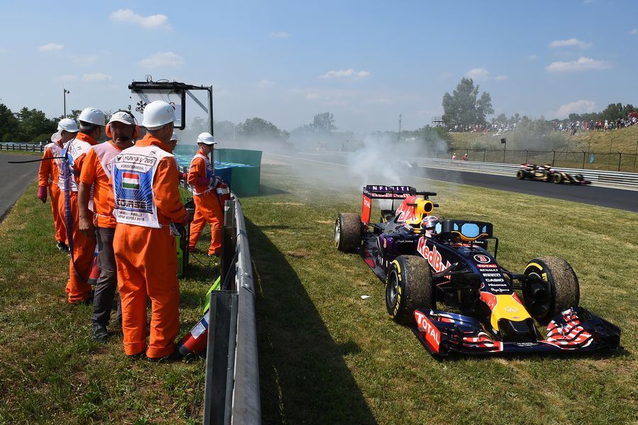 Daniel Ricciardo's Red Bull sits parked in the gravel