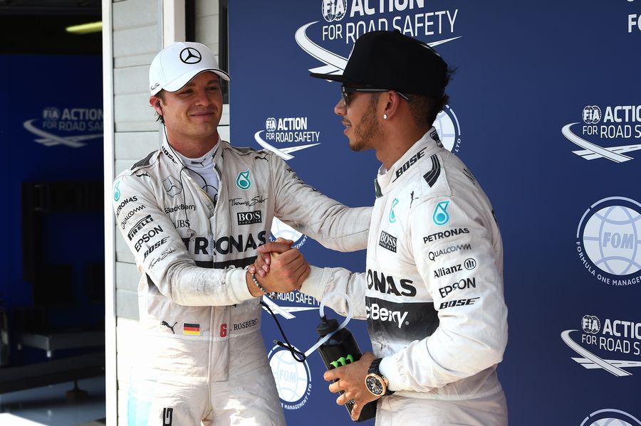Nico Rosberg congratulates pole sitter Lewis Hamilton