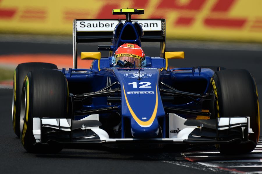 Felipe Nasr cranks on the steering lock in the Sauber