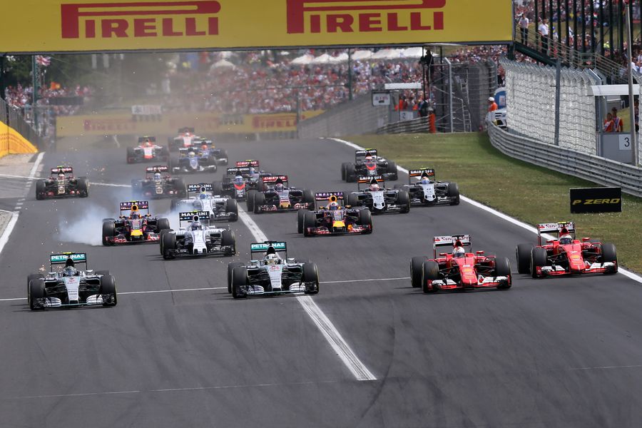 Sebastian Vettel takes lead from Lewis Hamilton at the start