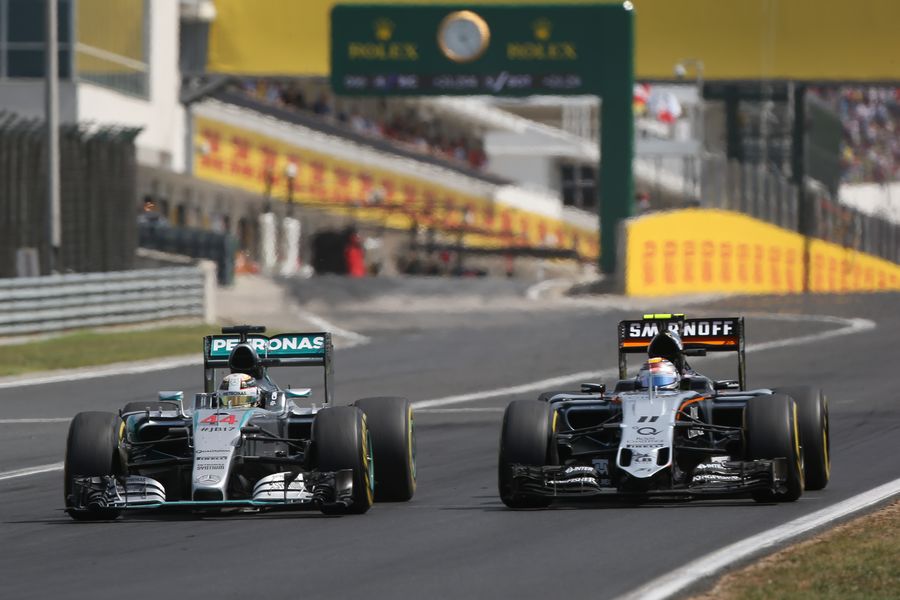 Lewis Hamilton and Sergio Perez battle for a position