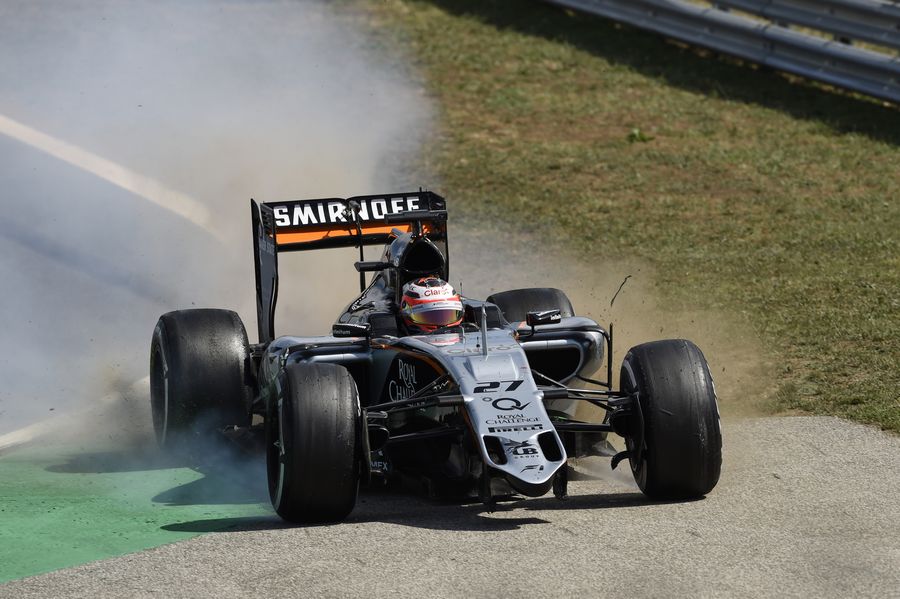 Nico Hulkenberg runs into gravel after losing his front wing