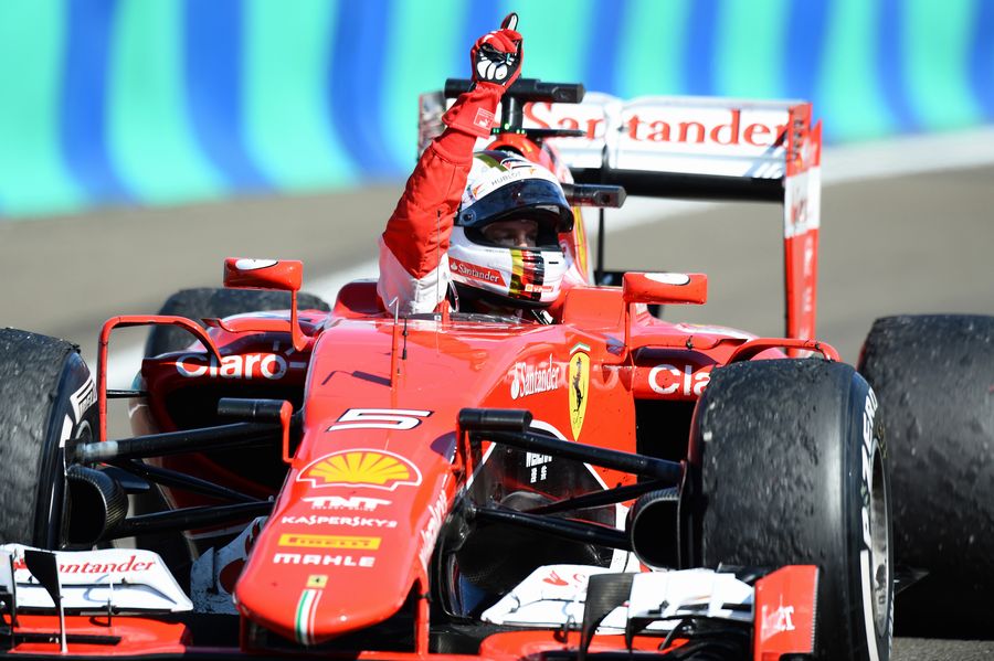 Race winner Sebastian Vettel celebrates his win