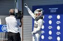 Lewis Hamilton celebrates taking pole position
