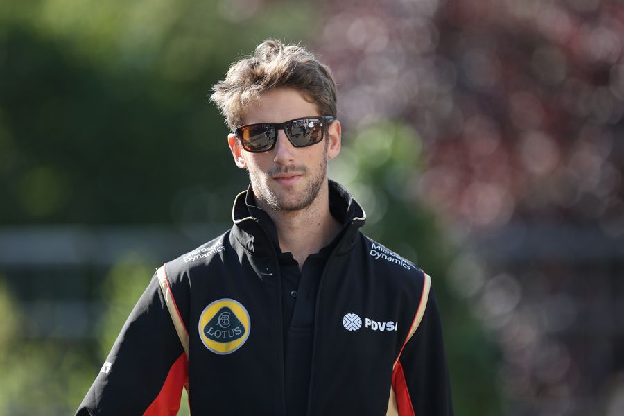Romain Grosjean walks through the paddock