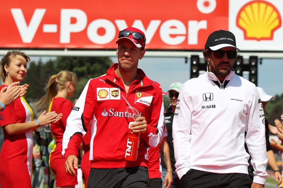 Sebastian Vettel and Fernando Alonso chat at the drivers parade