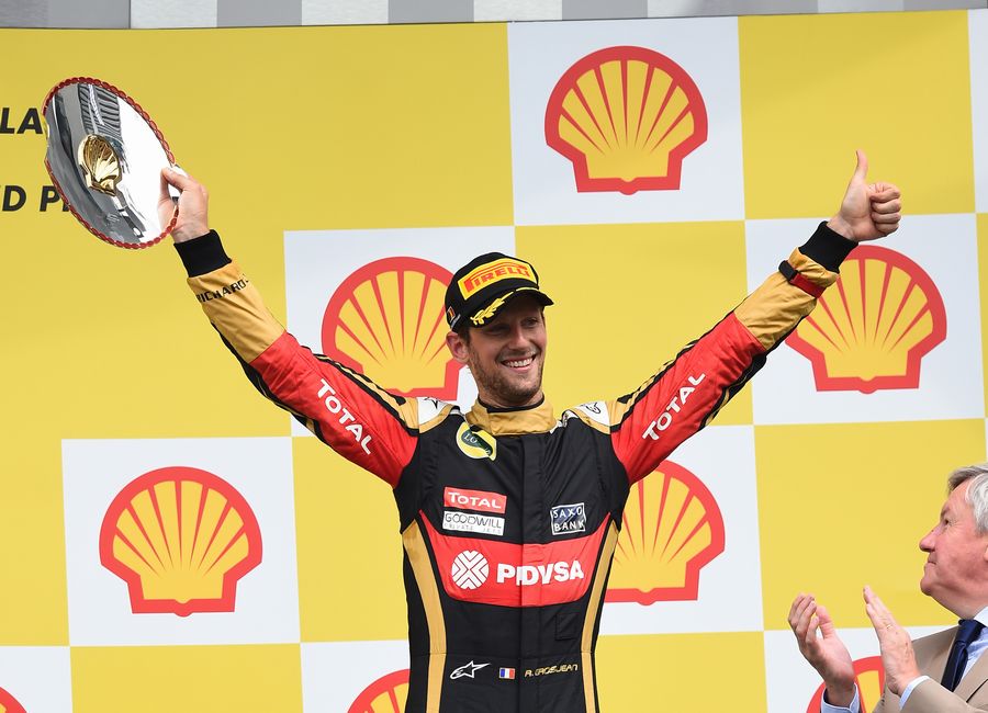 Romain Grosjean celebrates on the podium