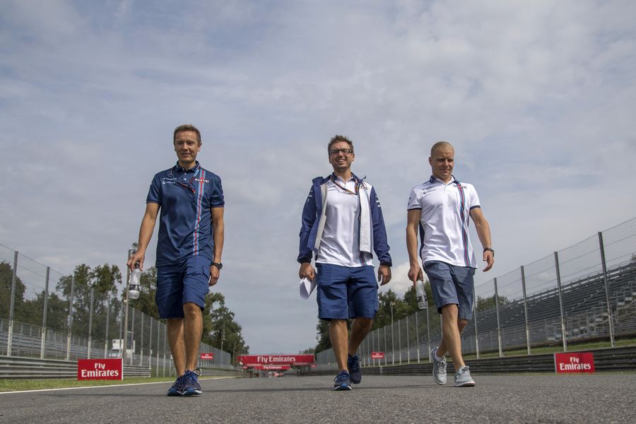 Valtteri Bottas walks the track with his trainer Antti Vierula